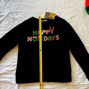 Ladies  Christmas sweater.  Black.. embellishments that sparkle like crazy.